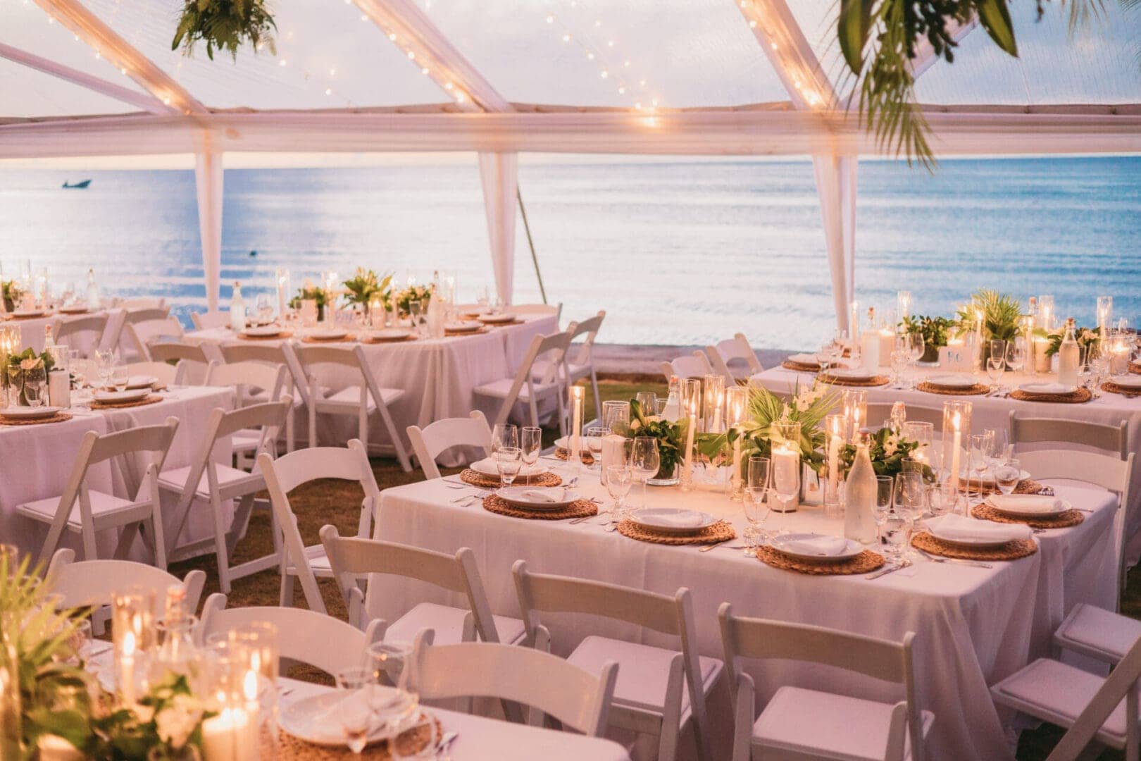 Under the tent facing the sea