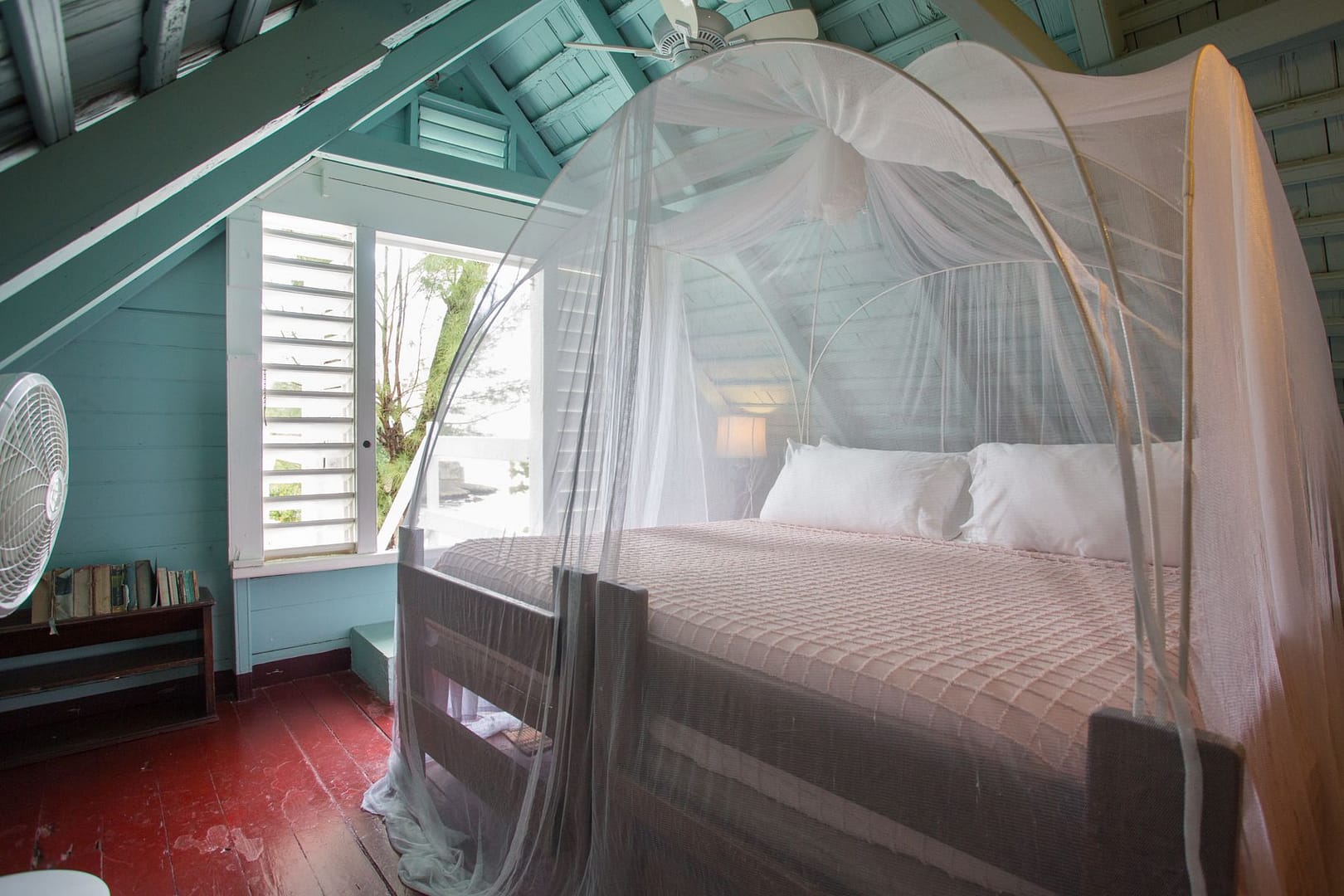 An upstairs bedroom under the original shingled roof